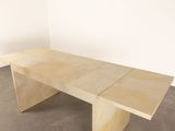 an image of a wooden table sitting on top of a cement floor