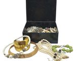 a black box with a bunch of jewelry inside of it