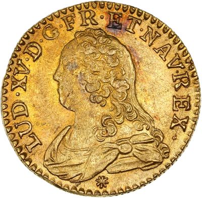 l'image d'une pièce d'or sur laquelle figure une tête de femme