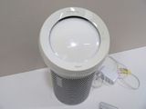 an image of a white air purifier sitting on a counter