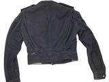 the back of a black jacket on a white background