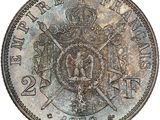a close up of a coin with a crown on it