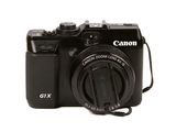 a camera that is sitting on a white surface