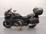 a picture of a black motorcycle parked in a room