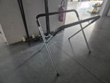 a ironing board on the floor in a garage