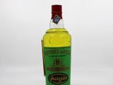 a bottle of olive oil sitting on a white surface