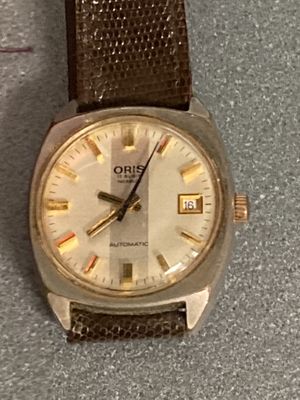 a close up of a wrist watch on a table