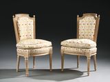 pair of chairs with floral upholstered upholstered seats