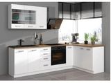 a picture of a kitchen with white cabinets and a black stove