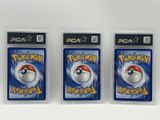 three packs of pokemon nintendo wii game cards on a white surface