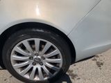 a close up of a car ' s tire on the street