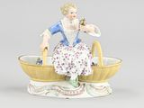 porcelain figurine of a woman sitting in a basket with flowers