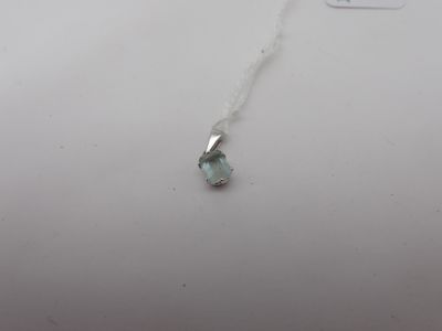 a necklace with a blue topaz stone on a silver chain
