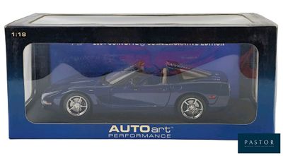 the box is open to show the model car in it ' s packaging