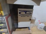 a small oven sitting on top of a wooden table