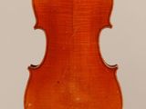 an old violin with a wooden back and bow on a white background