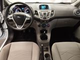 the interior of a car with a steering wheel, dashboard, and dashboard controls