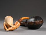 a wooden pipe and a wooden ball on a table