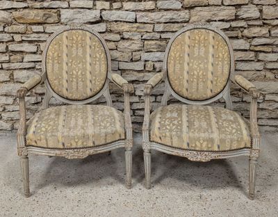 pair of antique chairs with upholstered upholstered back and arms