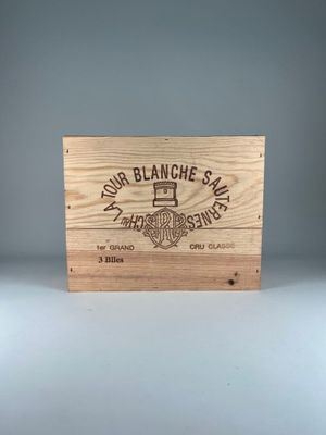 a wooden box with a logo on it sitting on a table
