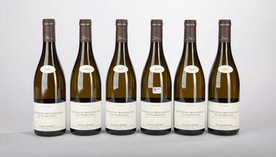 six bottles of wine are lined up in a row on a table