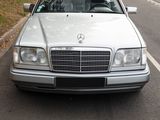 a silver car that is parked on the side of the road