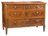 a wooden chest of drawers with brass knobs on each drawer
