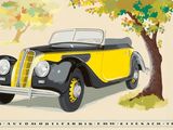 une voiture jaune et noire garée près d'un arbre