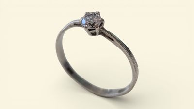 a close up of a diamond ring on a white background