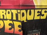 a poster on the side of a building advertising a movie