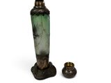 two vases sitting next to each other on a white surface