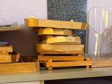 a table with a bunch of wooden toys on top of it