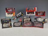 a lot of diecast cars in boxes on a table