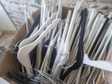 a cardboard box full of scissors and a pair of sandals
