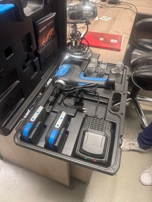a tool case with tools in it sitting on the floor
