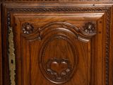 a wooden cabinet that has a mirror on top of it