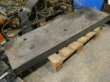 a large piece of concrete sitting on a pallet in a warehouse