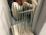 a metal rack that is sitting in the corner of a room