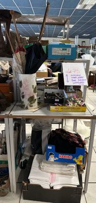 a table with a bunch of items on it in a store