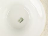 a white plate with a green square on it