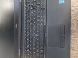 two laptops that are open on a table