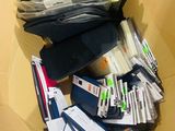 a cardboard box full of files and papers on the floor