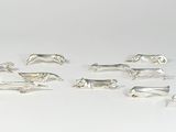silver plated animal figurines on a white background