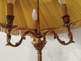 a lamp that is sitting on a table with a yellow umbrella