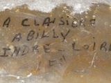a close up of a rock with writing on it