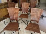 four chairs are arranged in a circle in a living room