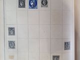 an open book with a picture of a map and stamps on it