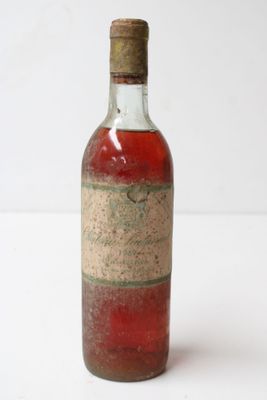 a bottle of wine that is sitting on a table