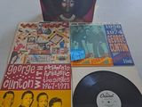 a lot of records on a table in a room