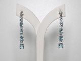 paire de boucles d'oreilles en cristal de topaze bleue et de topaze blanche